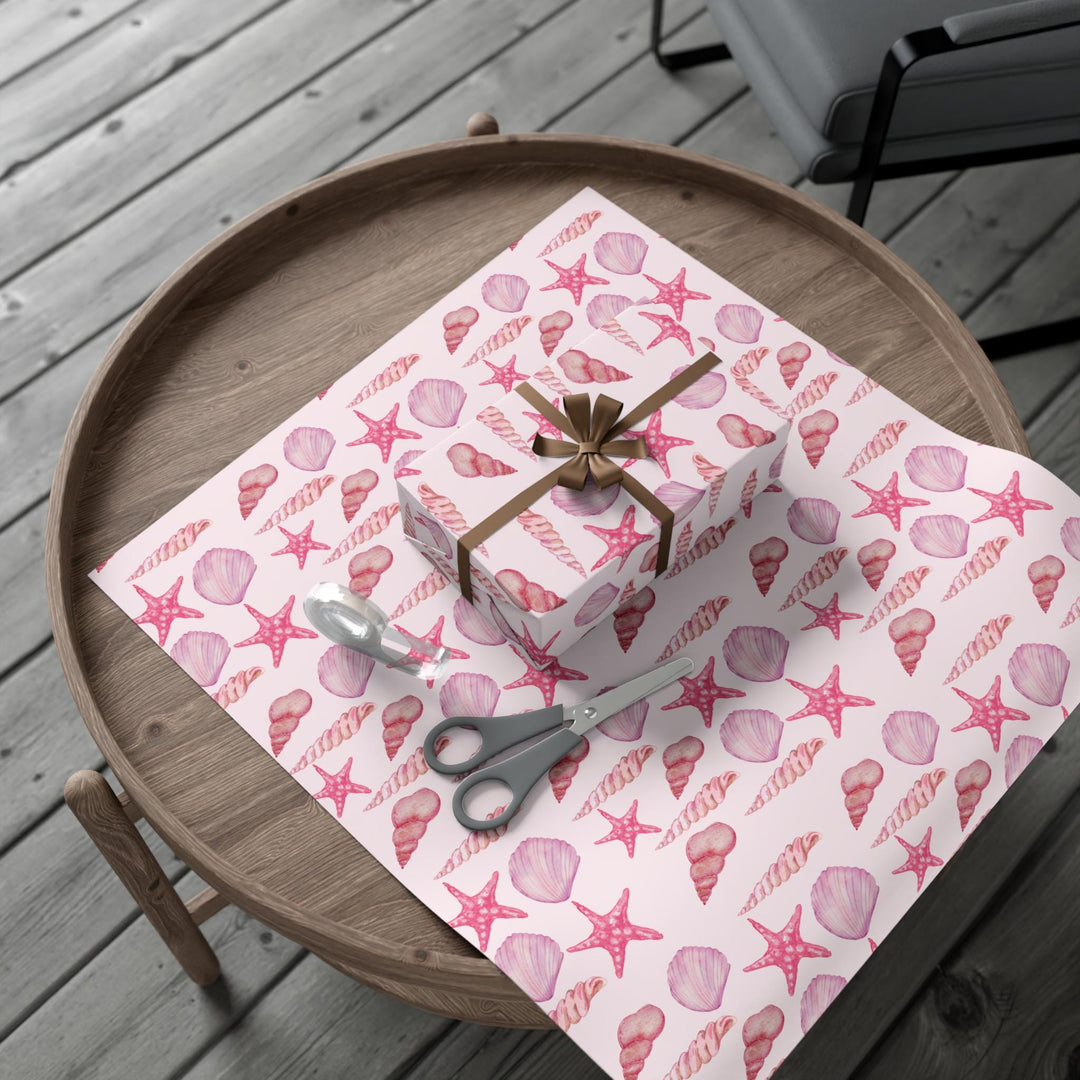 Pink wrapping paper with pink seashell pattern, different seashell shapes in fun bright pink colors