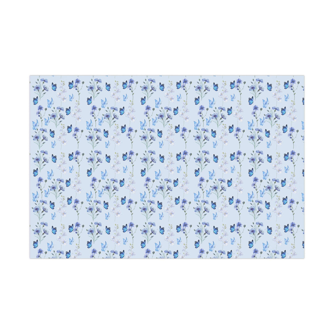 Light pastel blue wrapping paper with graphics of purple lilac flowers and blue butterflies