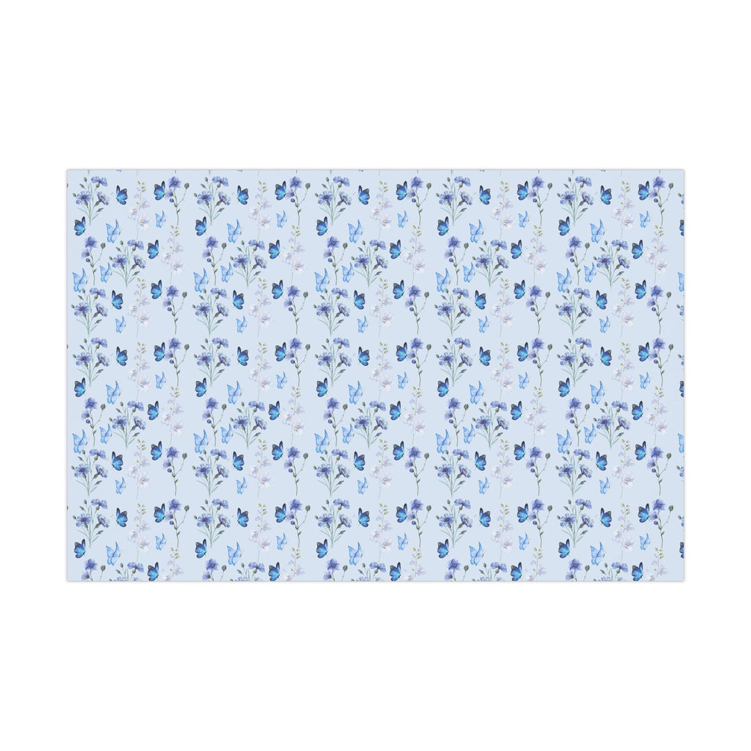 Light pastel blue wrapping paper with graphics of purple lilac flowers and blue butterflies