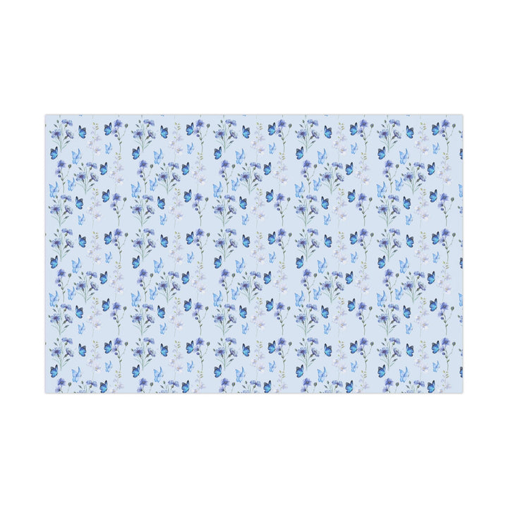 Light pastel blue wrapping paper with graphics of purple lilac flowers and blue butterflies