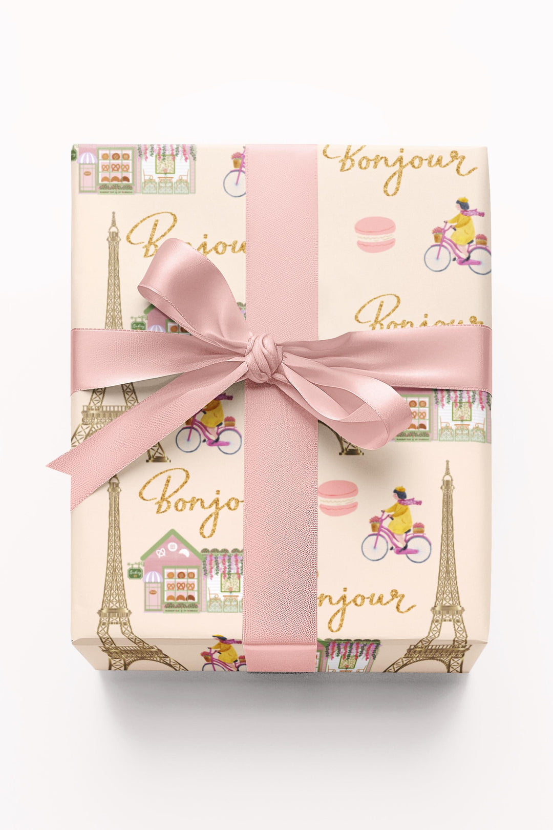 Elegant Paris themed wrapping paper in beige with super cute and fun graphics of a gold Eiffel Tower, adorable French bakery that has florals on the roof of it, &quot;bonjour&quot; text, woman riding her bicycle, pink macaroon