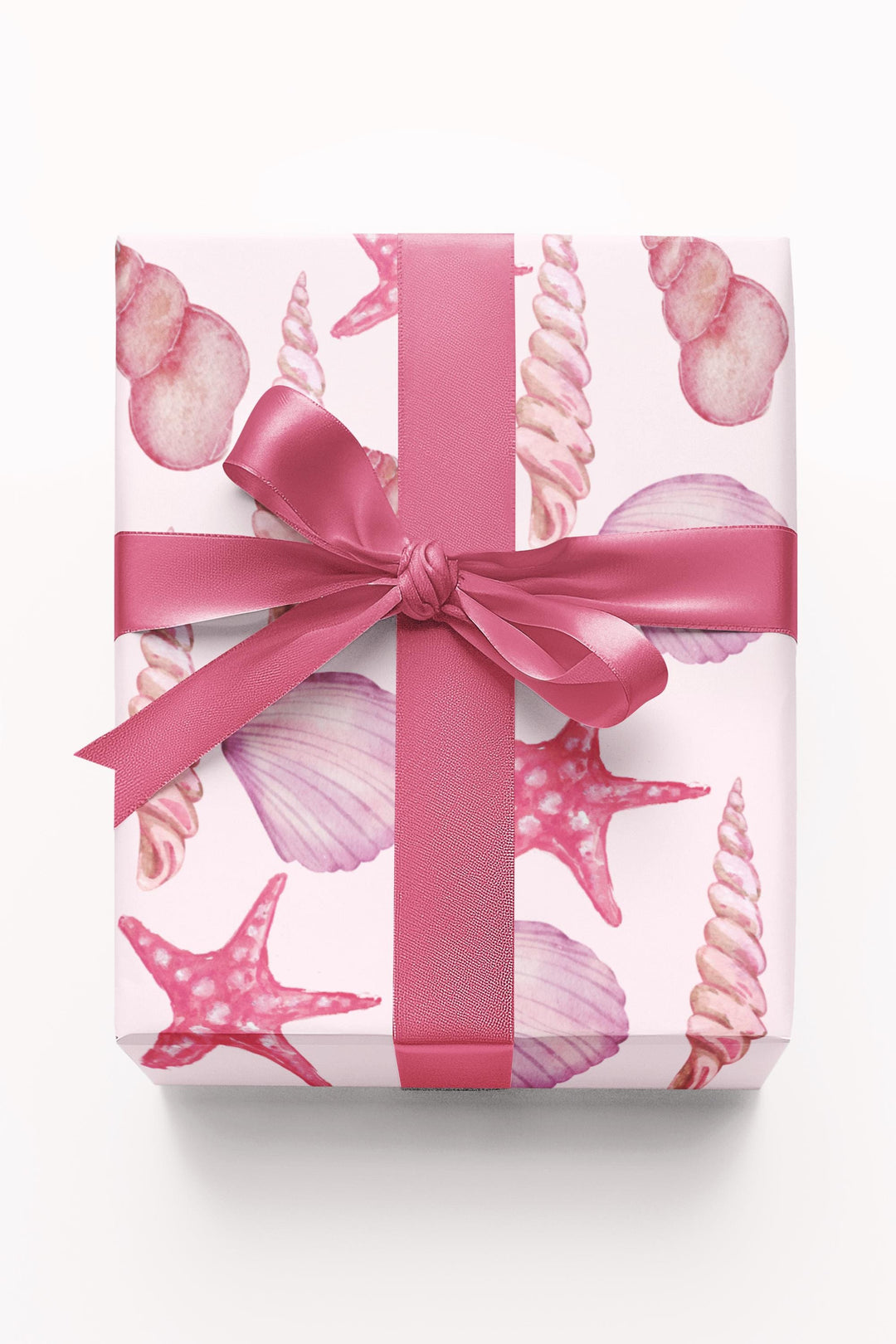 Pink wrapping paper with pink seashell pattern, different seashell shapes in fun bright pink colors