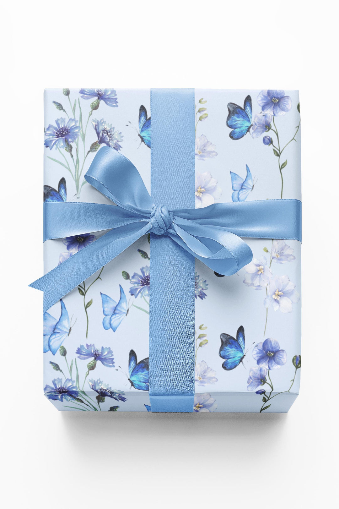 Light pastel blue wrapping paper with graphics of purple lilac flowers and blue butterflies