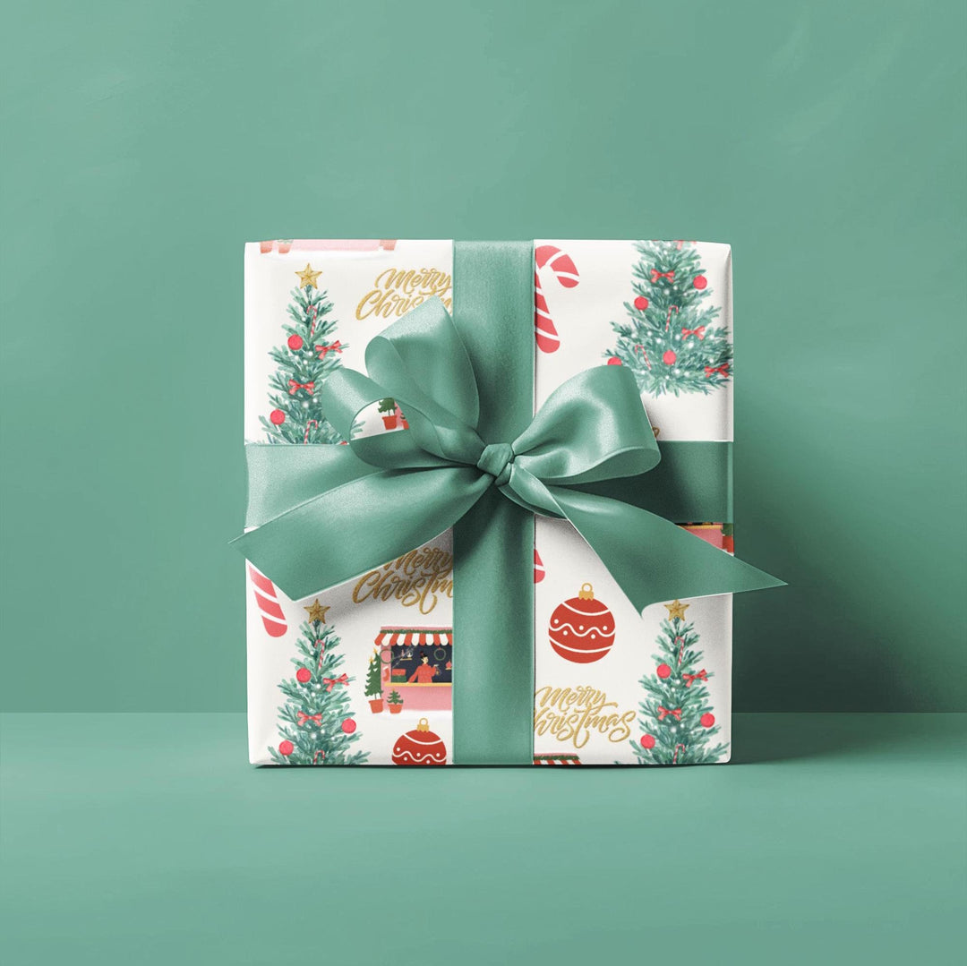 Christmas themed wrapping paper with watercolor graphics of a candy cane, Christmas shop, ornaments and a Christmas tree that has red ornaments. can be printed on a shiny or a matte paper and comes in 3 sizes