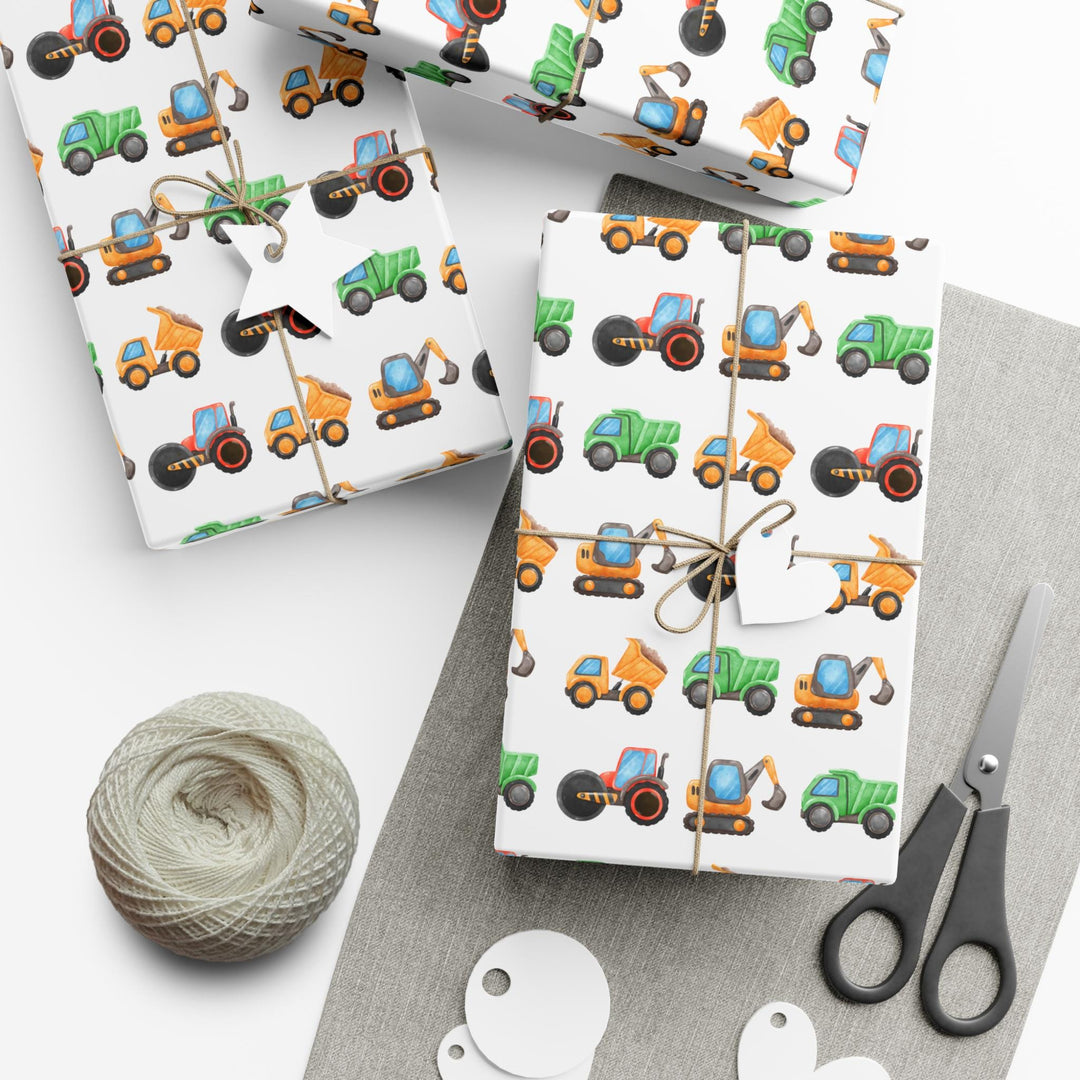 Wrapping paper with white background and cute graphics of construction trucks and vehicles for truck lovers and boys birthday gifts