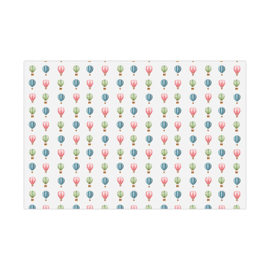 White wrapping paper with cute graphics of hot air balloons in different colors- green blue and pink !