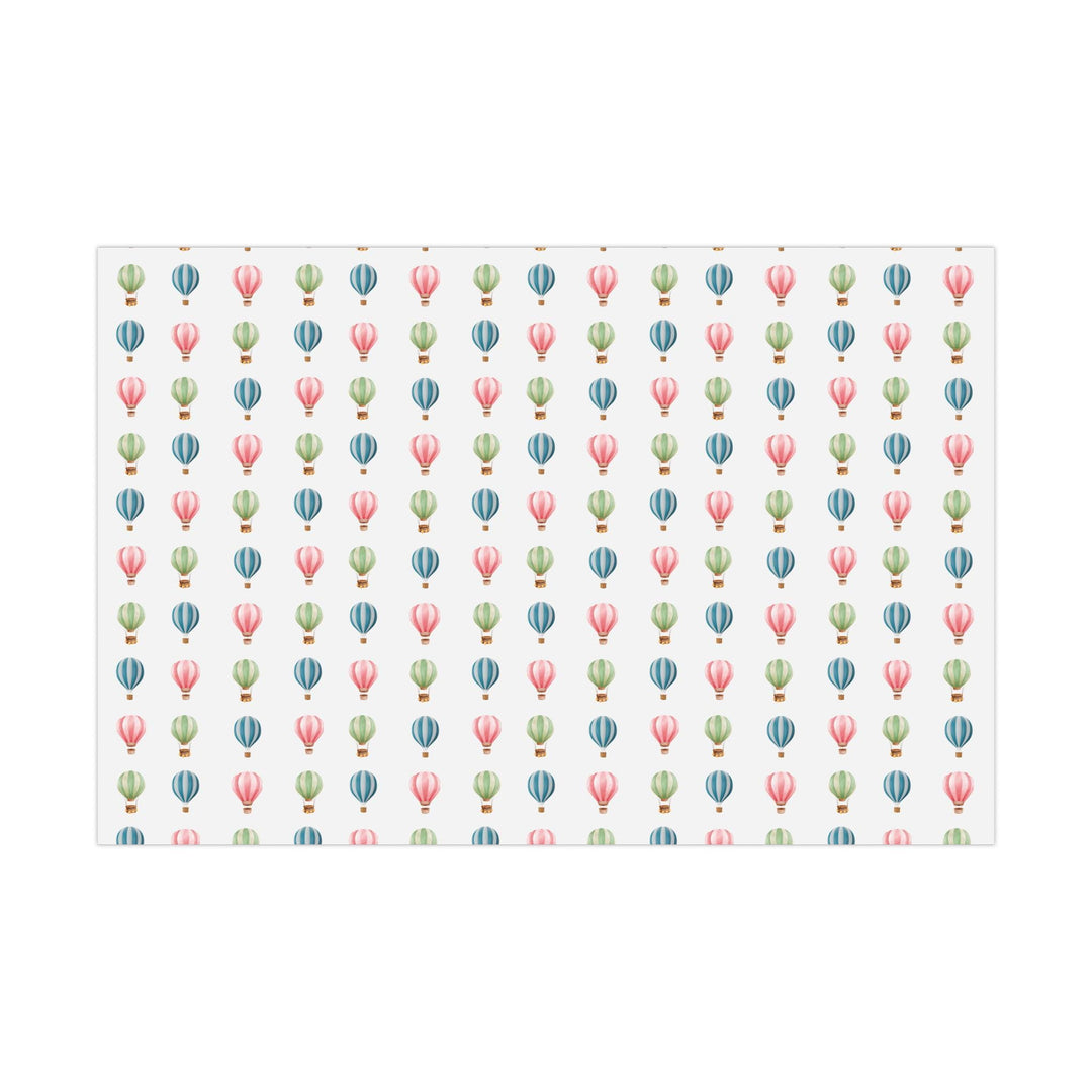 White wrapping paper with cute graphics of hot air balloons in different colors- green blue and pink !