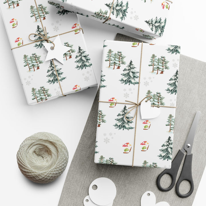 Wrapping paper with Off white background and a ski landscape of trees with a duck in a christmas Santa hat skiing