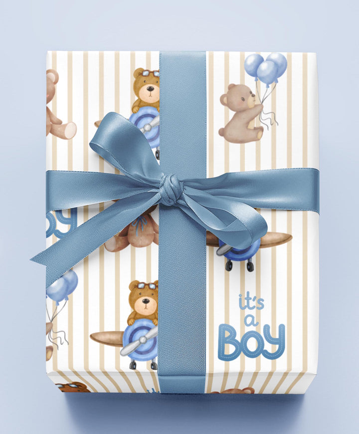 Beige striped wrapping paper with Its a boy text and graphics of little brown bears with blue balloons