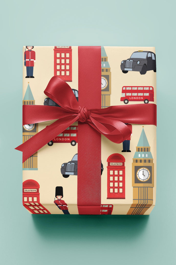 London themed wrapping paper with palace guard, black taxi, Big Ben, telephone booth on tan wrapping paper