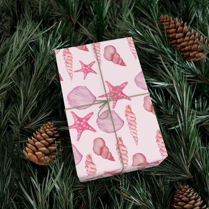 Pink wrapping paper with pink seashell pattern, different seashell shapes in fun bright pink colors