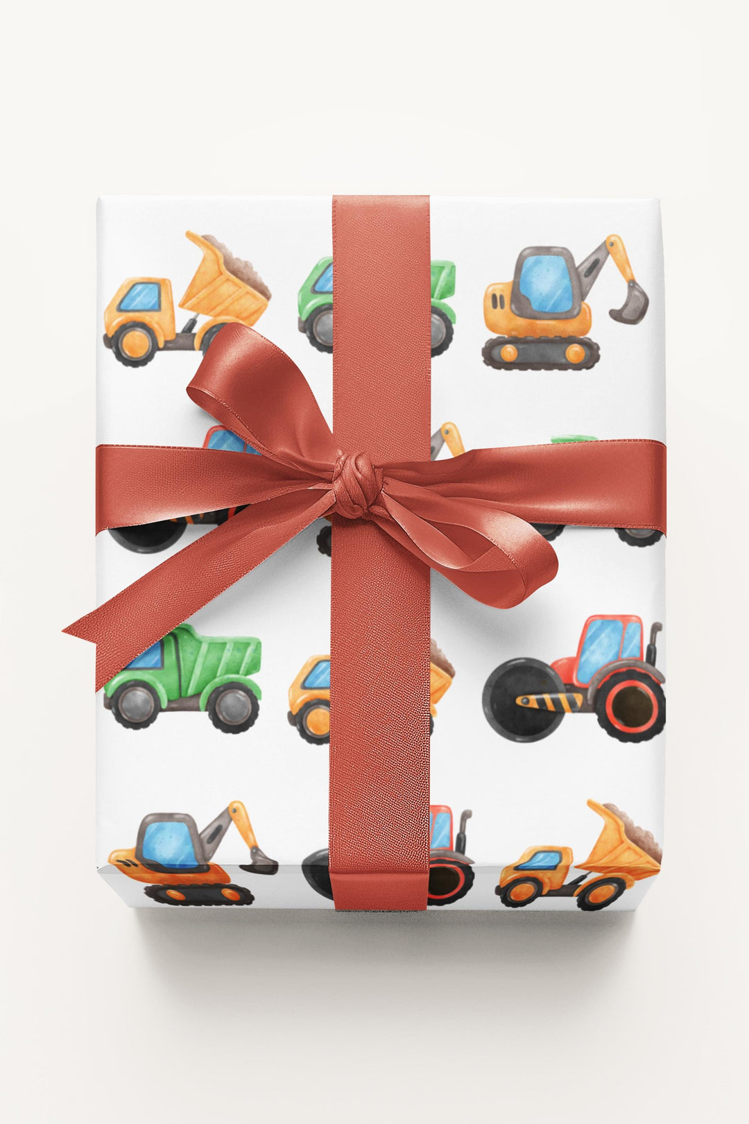 Wrapping paper with white background and cute graphics of construction trucks and vehicles for truck lovers and boys birthday gifts