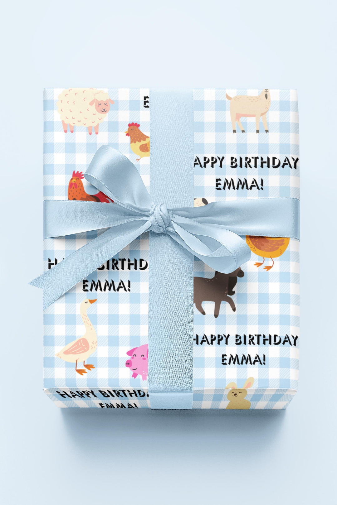 Blue gingham gingham pattern with graphics of cute farm animals and Happy birthday text that can be personalized with any name