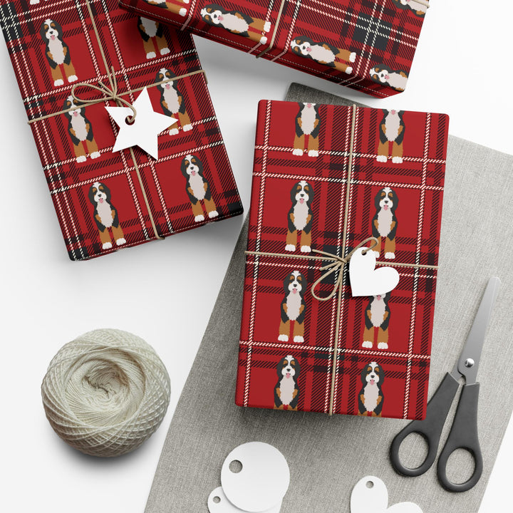 Plaid red and black background with graphics of bernedoodle dogs in a clean pattern wrapping paper