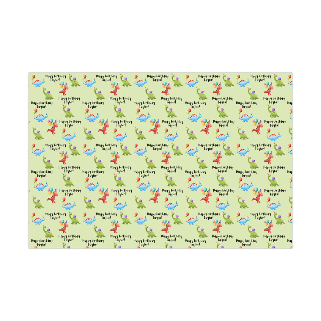 Green wrapping paper with dinosaur fun cute graphics with birthday hats and balloons and personalized happy birthday text