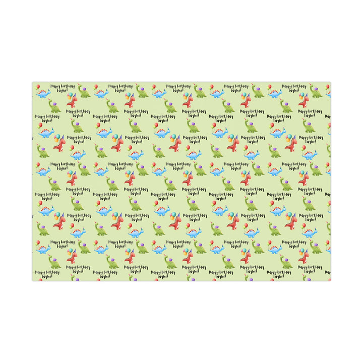 Green wrapping paper with dinosaur fun cute graphics with birthday hats and balloons and personalized happy birthday text