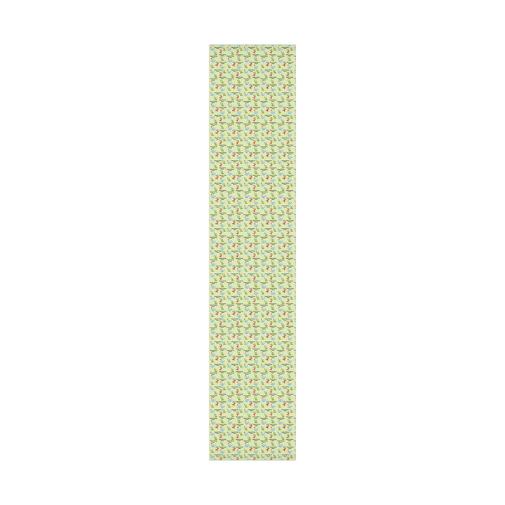 Green wrapping paper with dinosaur fun cute graphics with birthday hats and balloons and personalized happy birthday text