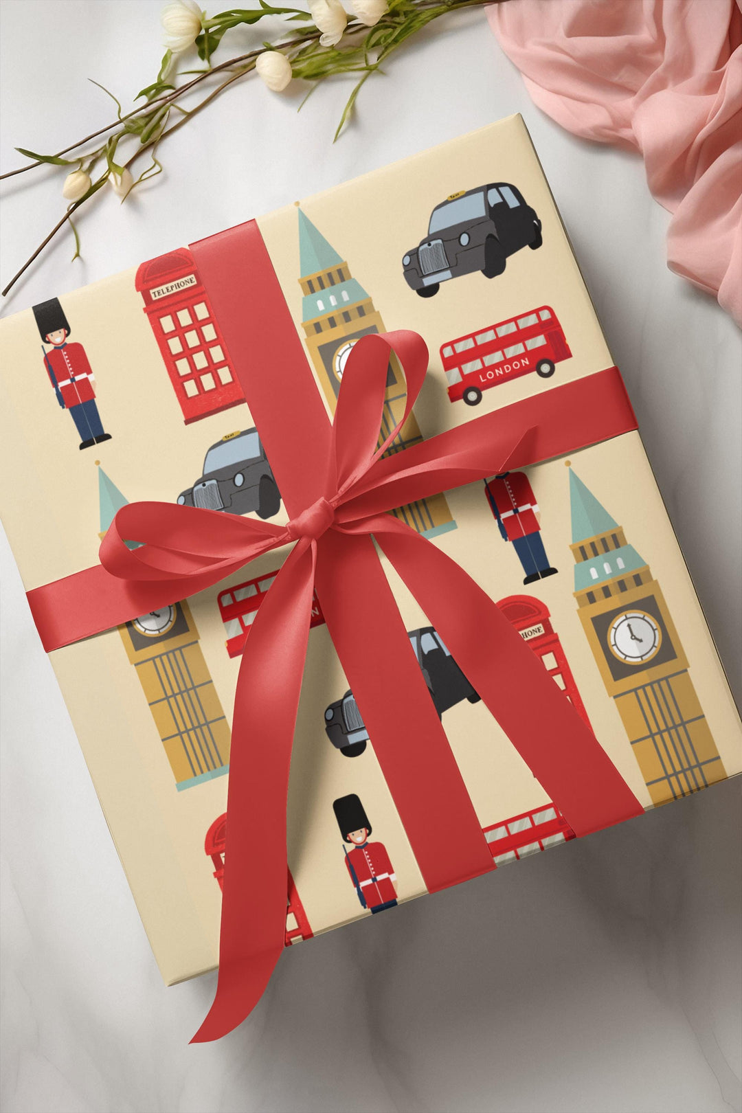 London themed wrapping paper with palace guard, black taxi, Big Ben, telephone booth on tan wrapping paper