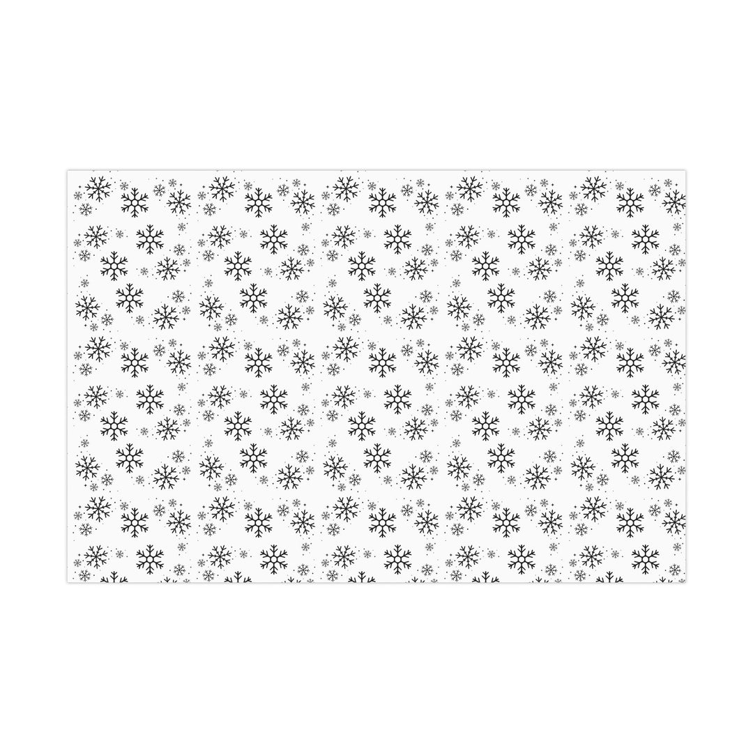 wrapping paper with white background and black snowflakes all over in a subtle but minimal look! beautiful and elegant black and white look!