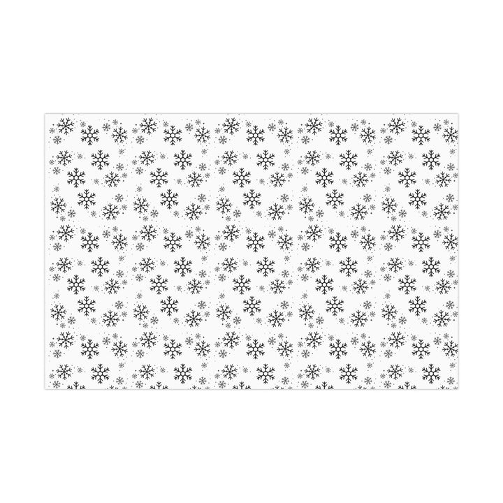 wrapping paper with white background and black snowflakes all over in a subtle but minimal look! beautiful and elegant black and white look!