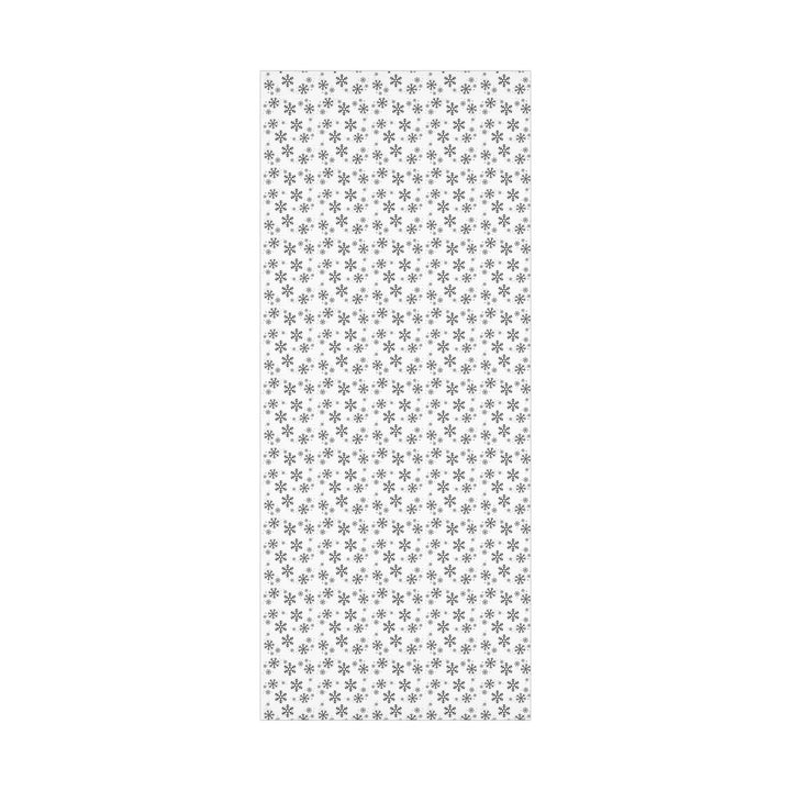 wrapping paper with white background and black snowflakes all over in a subtle but minimal look! beautiful and elegant black and white look!