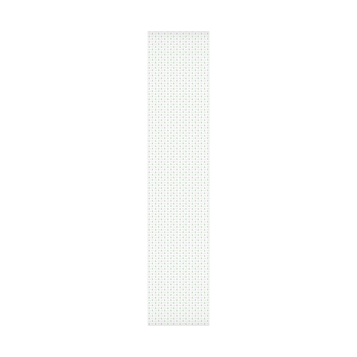 white background with elegant green christmas trees and display font of a personalized name on wrapping paper