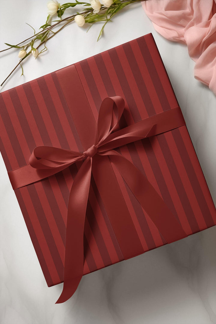 Red stripes on red background wrapping paper for the holidays