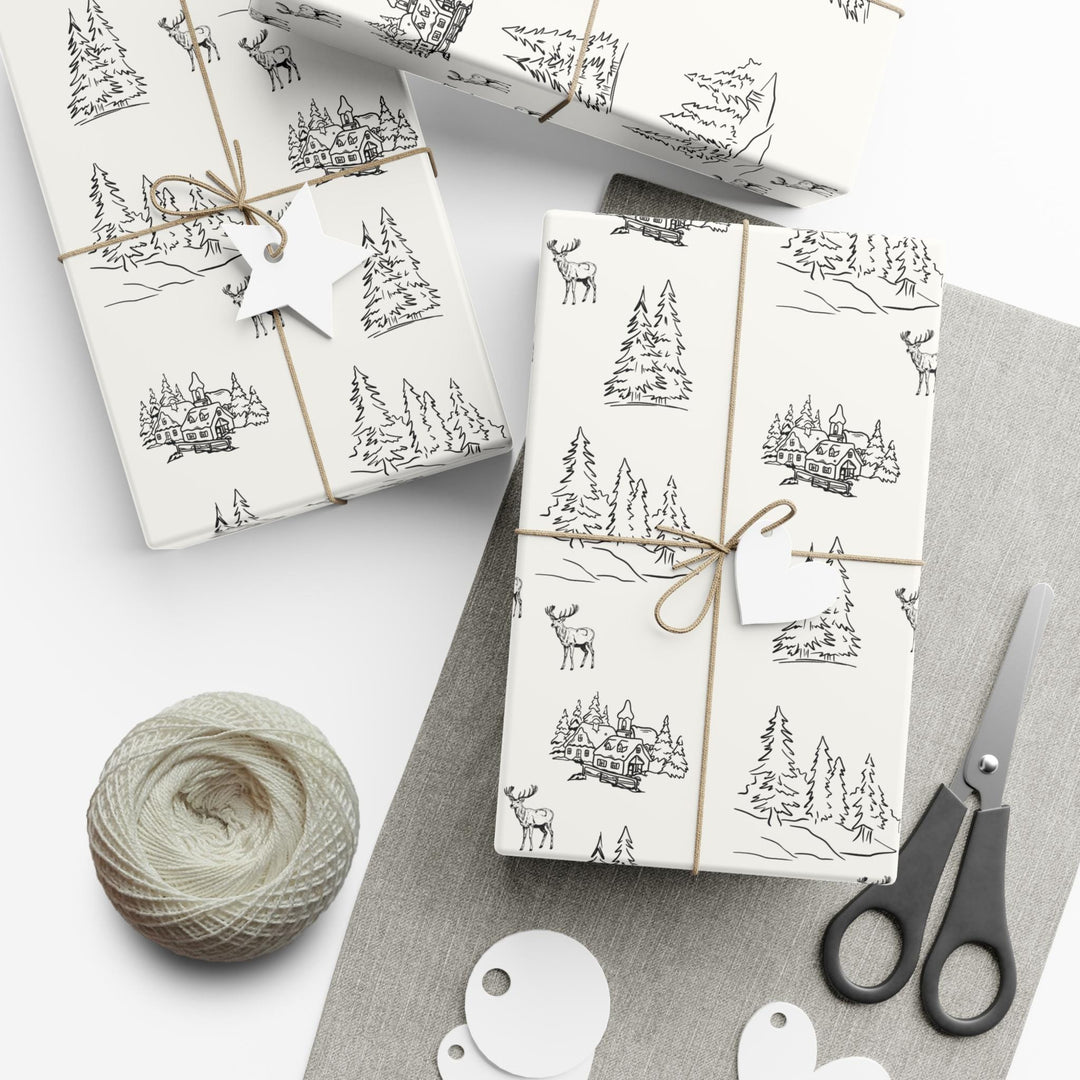 off white background with black silhouettes of christmas trees and  town and christmas log cabin with reindeer graphics- elegant and understated but beautiful and classic