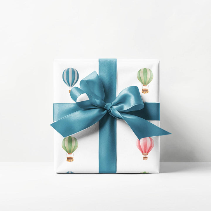 White wrapping paper with cute graphics of hot air balloons in different colors- green blue and pink !