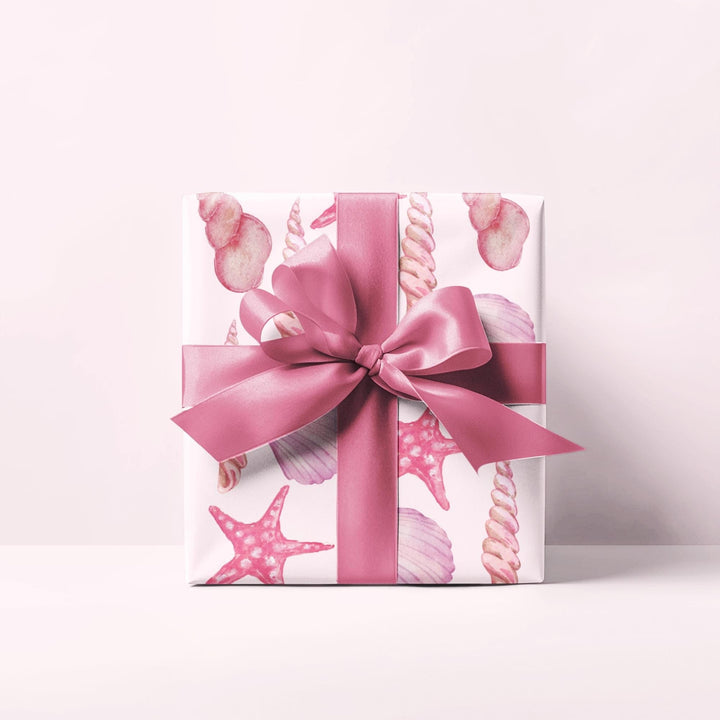 Pink wrapping paper with pink seashell pattern, different seashell shapes in fun bright pink colors