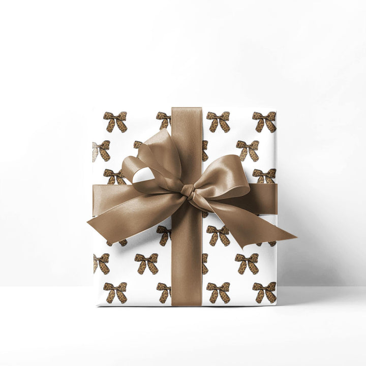 leopard print bow themed wrapping paper with white background