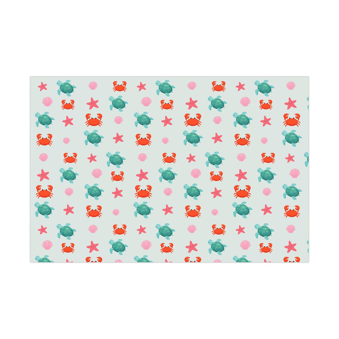 off white background with cute graphics of smiling sea creatures-sea turtle, crab, starfish, pink seashell on wrapping paper!