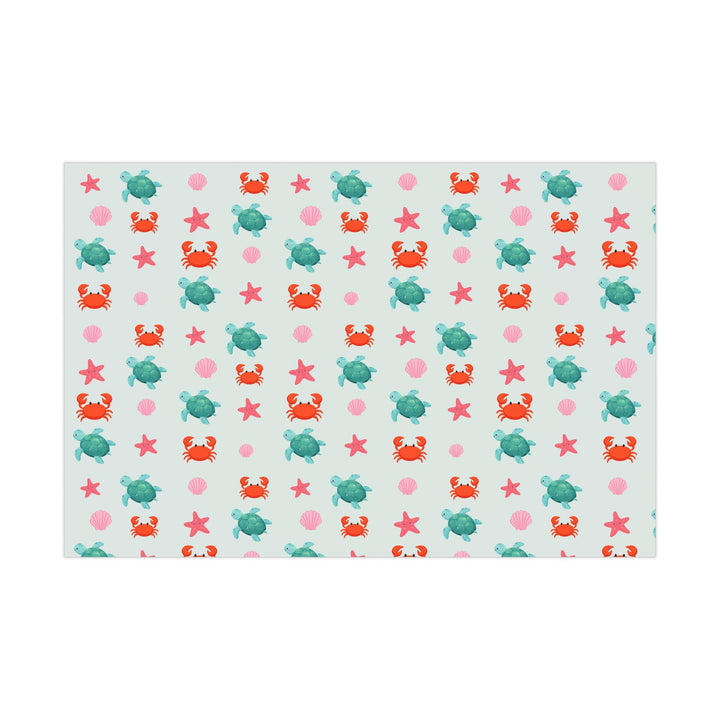 off white background with cute graphics of smiling sea creatures-sea turtle, crab, starfish, pink seashell on wrapping paper!