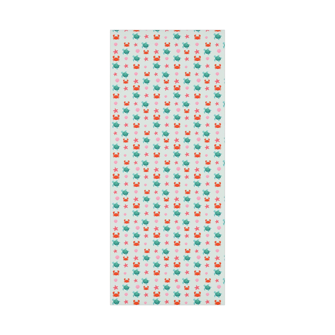 off white background with cute graphics of smiling sea creatures-sea turtle, crab, starfish, pink seashell on wrapping paper!