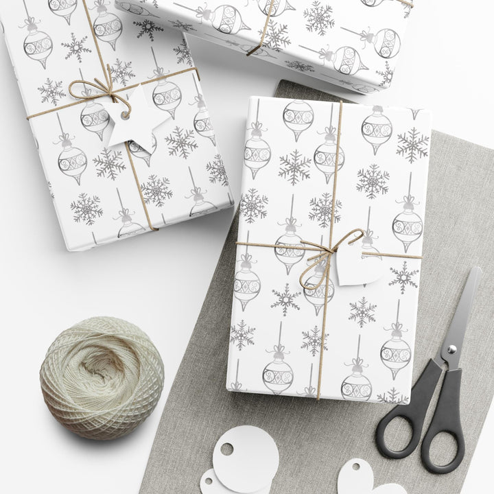 wrapping paper with white background and silver ornaments and silver snowflakes- subtle clean and elegant!