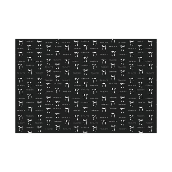 black wrapping paper with white bows and personalized name! chic and trendy gift wrap