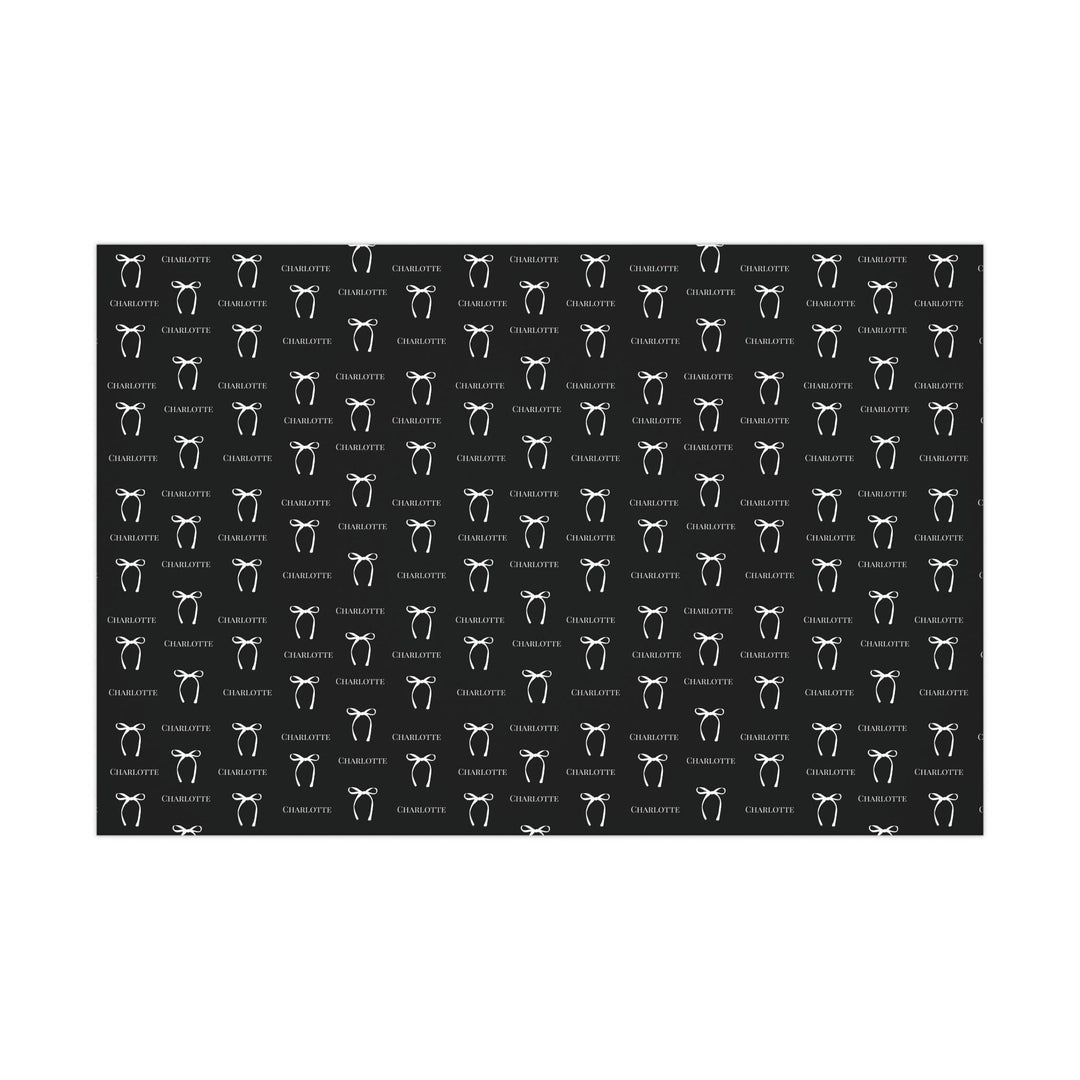 black wrapping paper with white bows and personalized name! chic and trendy gift wrap