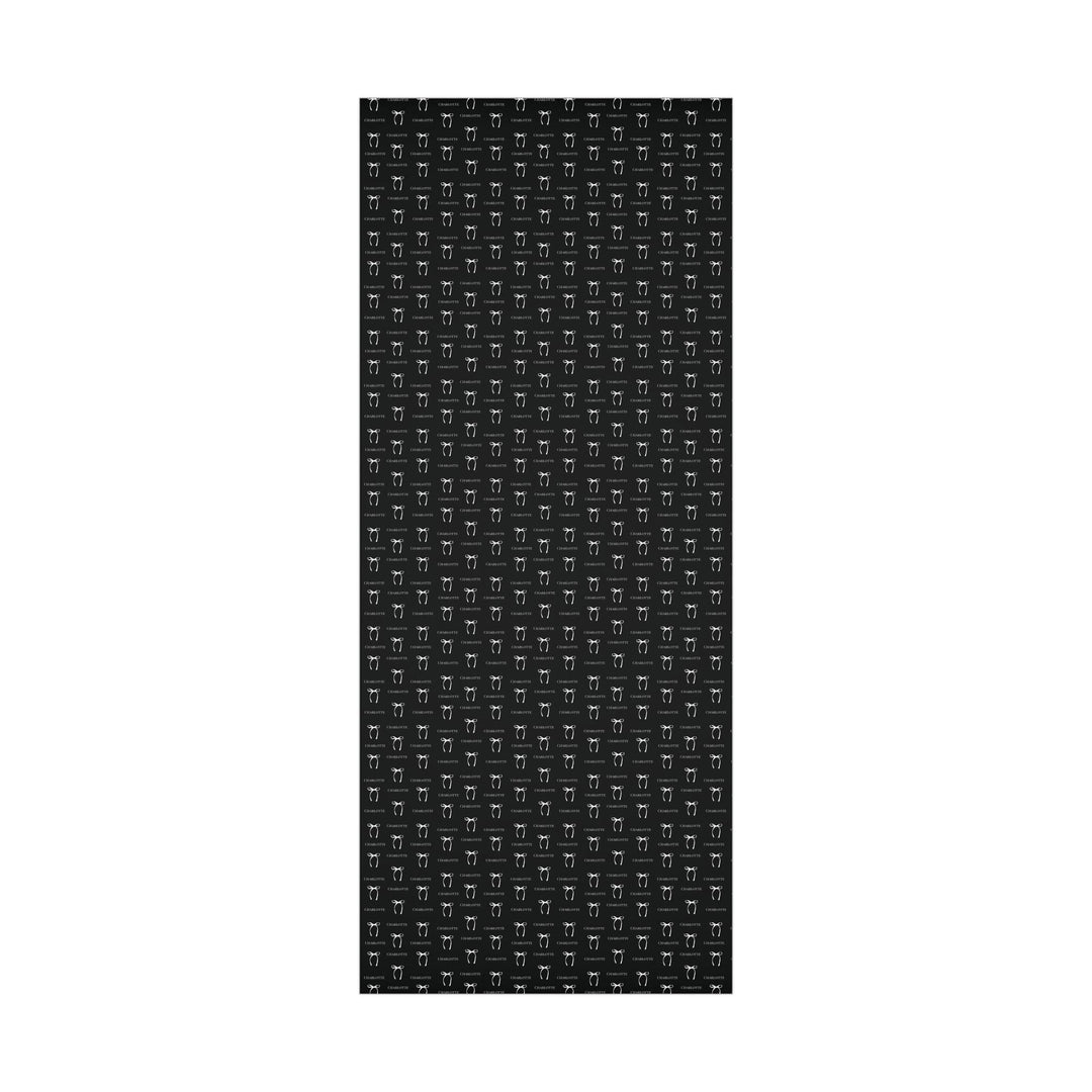 black wrapping paper with white bows and personalized name! chic and trendy gift wrap